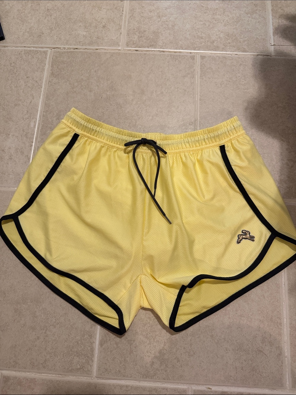 Tracksmith Yellow Mesh Running Shorts with Black Trim